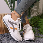 Białe, amortyzowane trampki w paski dla kobiet – stylowy i wygodny design 2