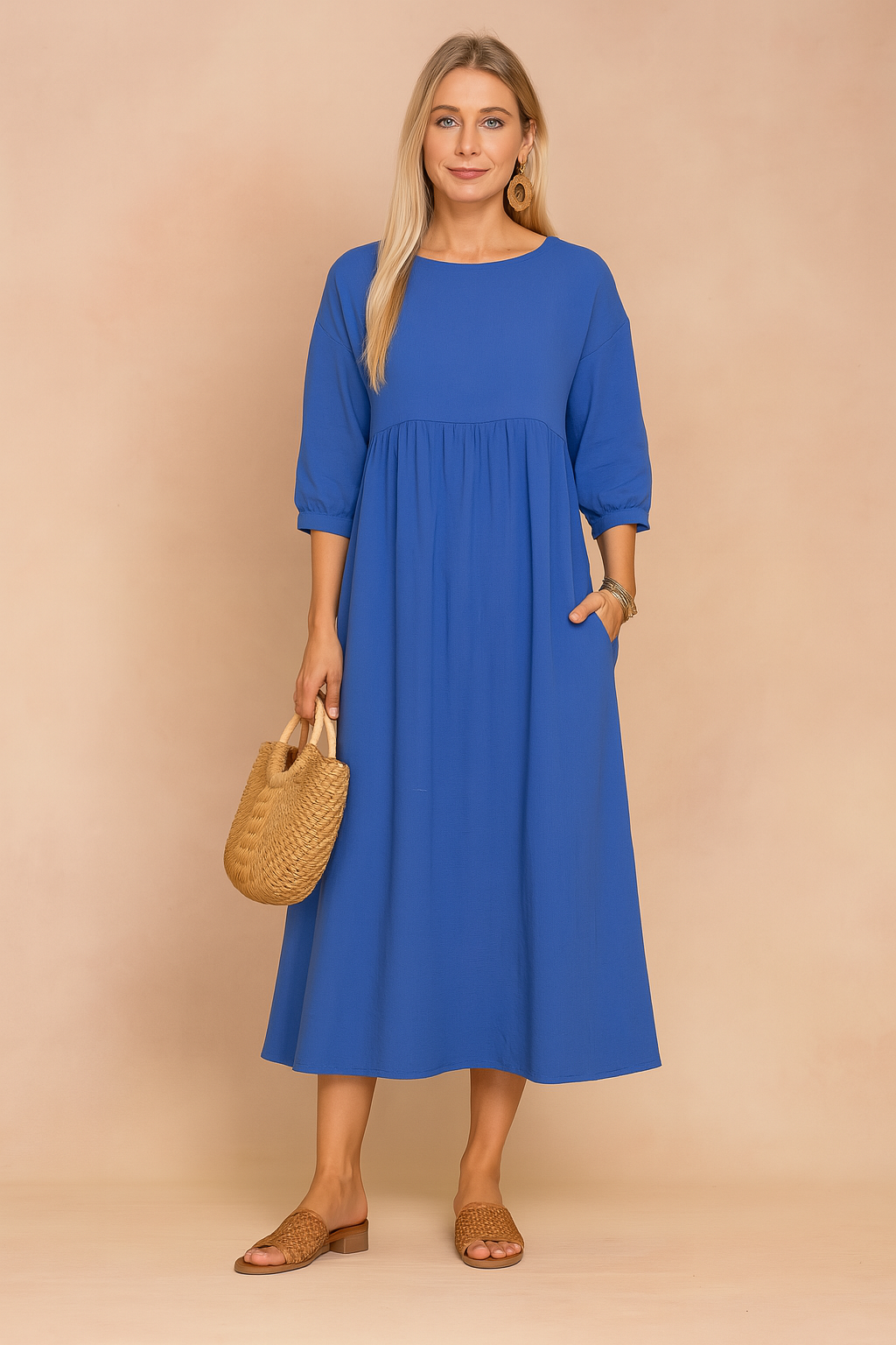 midi dress featuring three-quarter puff sleeves, a high gathered waistline, and a relaxed A-line silhouette