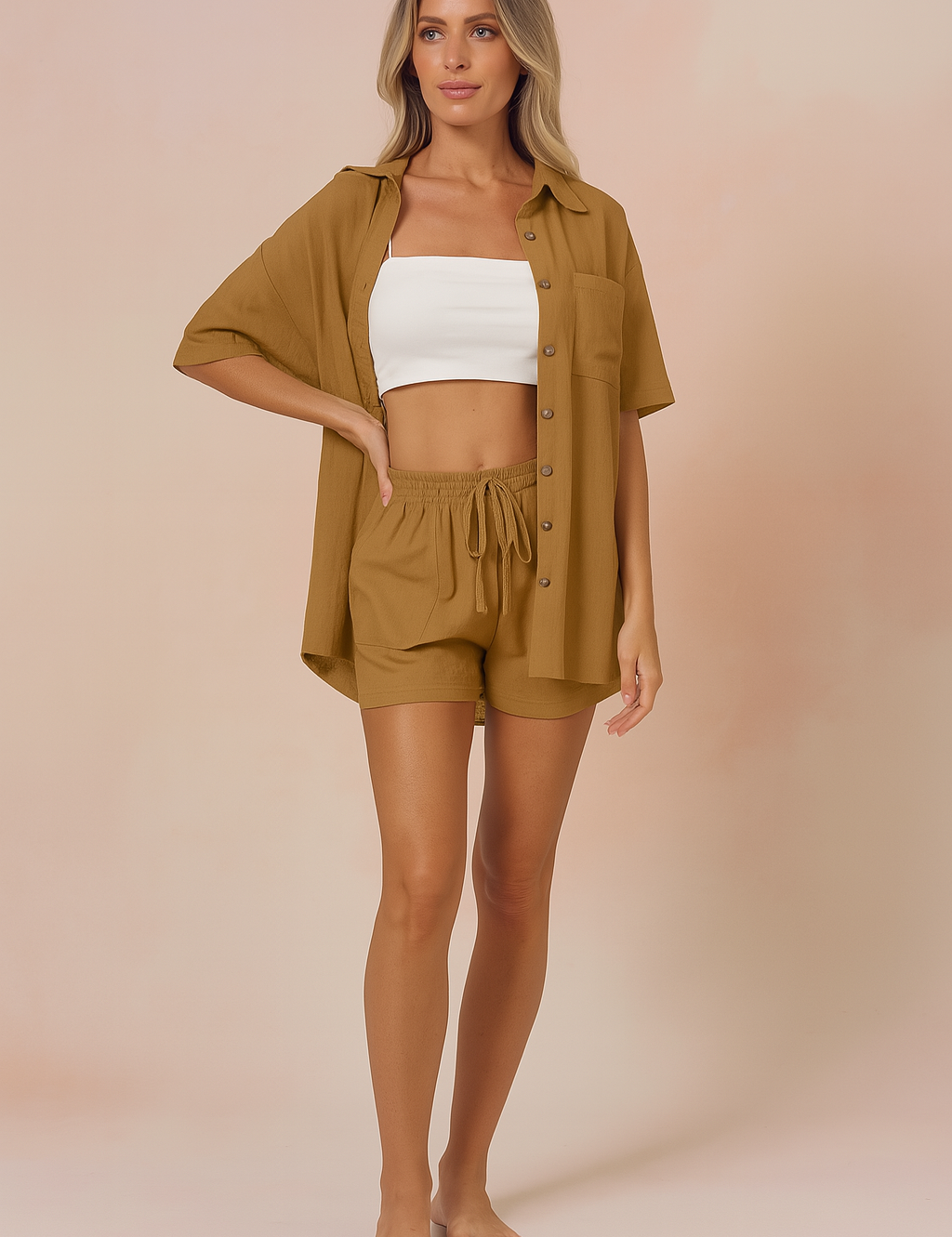 Two-piece summer co-ord set featuring a camel button-up shirt and matching high-waisted drawstring shorts for women, styled with a white bandeau top, ideal for warm weather casual fashion.