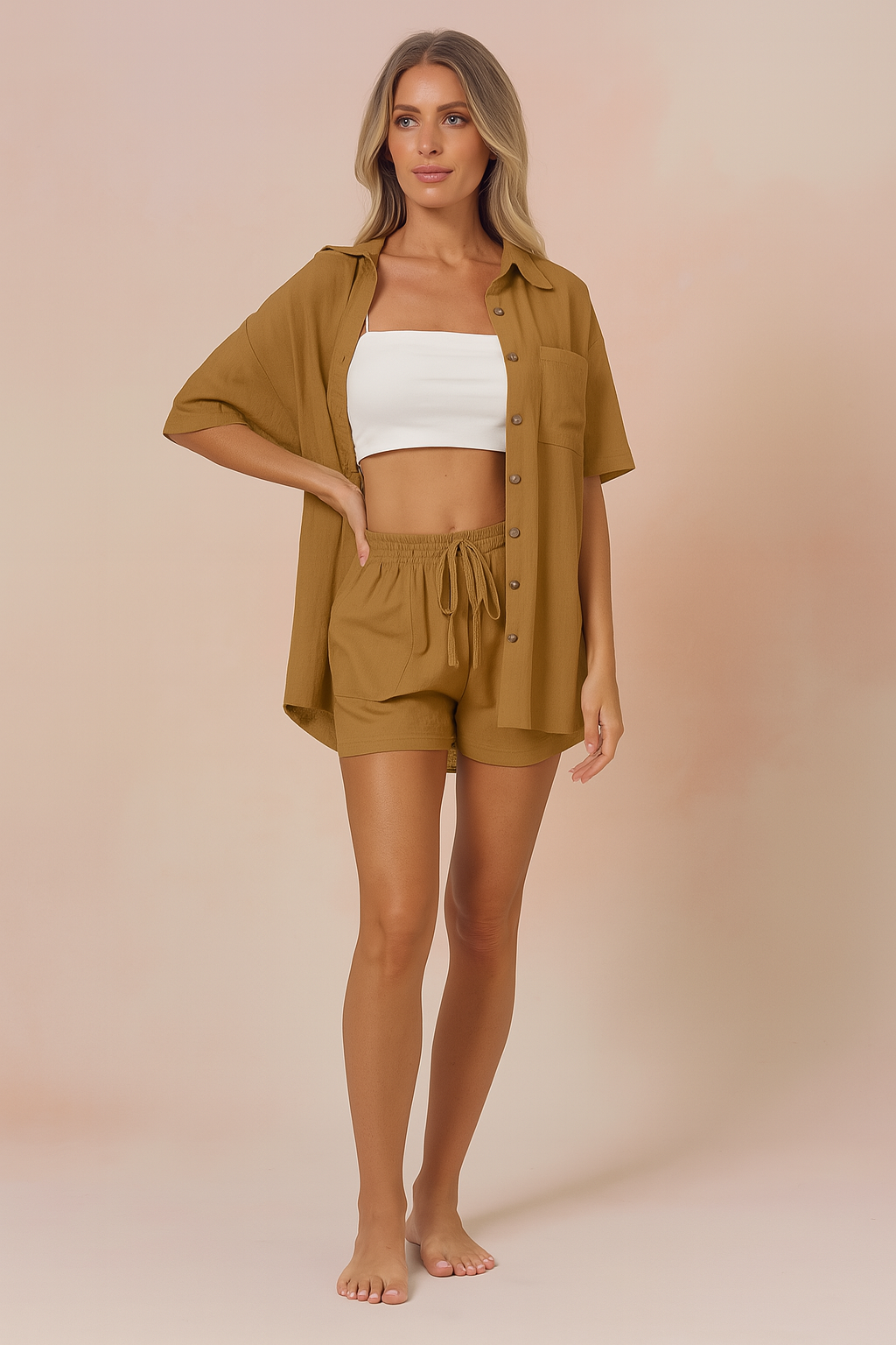 Two-piece summer co-ord set featuring a camel button-up shirt and matching high-waisted drawstring shorts for women, styled with a white bandeau top, ideal for warm weather casual fashion.