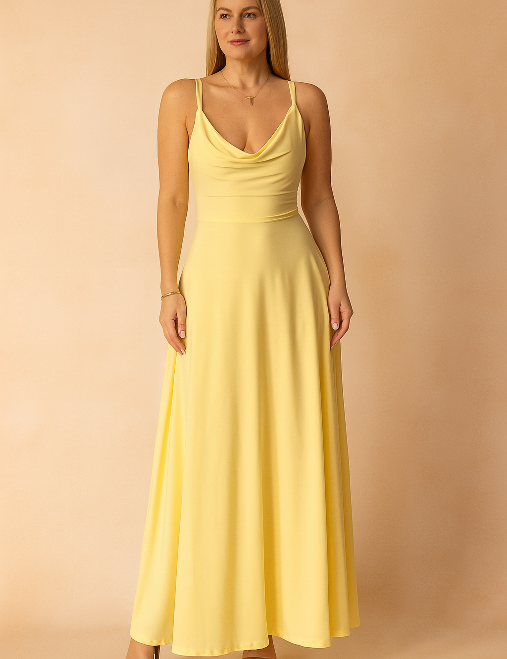 A yellow A-line maxi dress featuring a soft draped neckline and thin spaghetti straps, styled on a warm pastel background for a bright, elegant presentation.