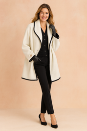 chic-white-coat-black-trim-full-body-pose