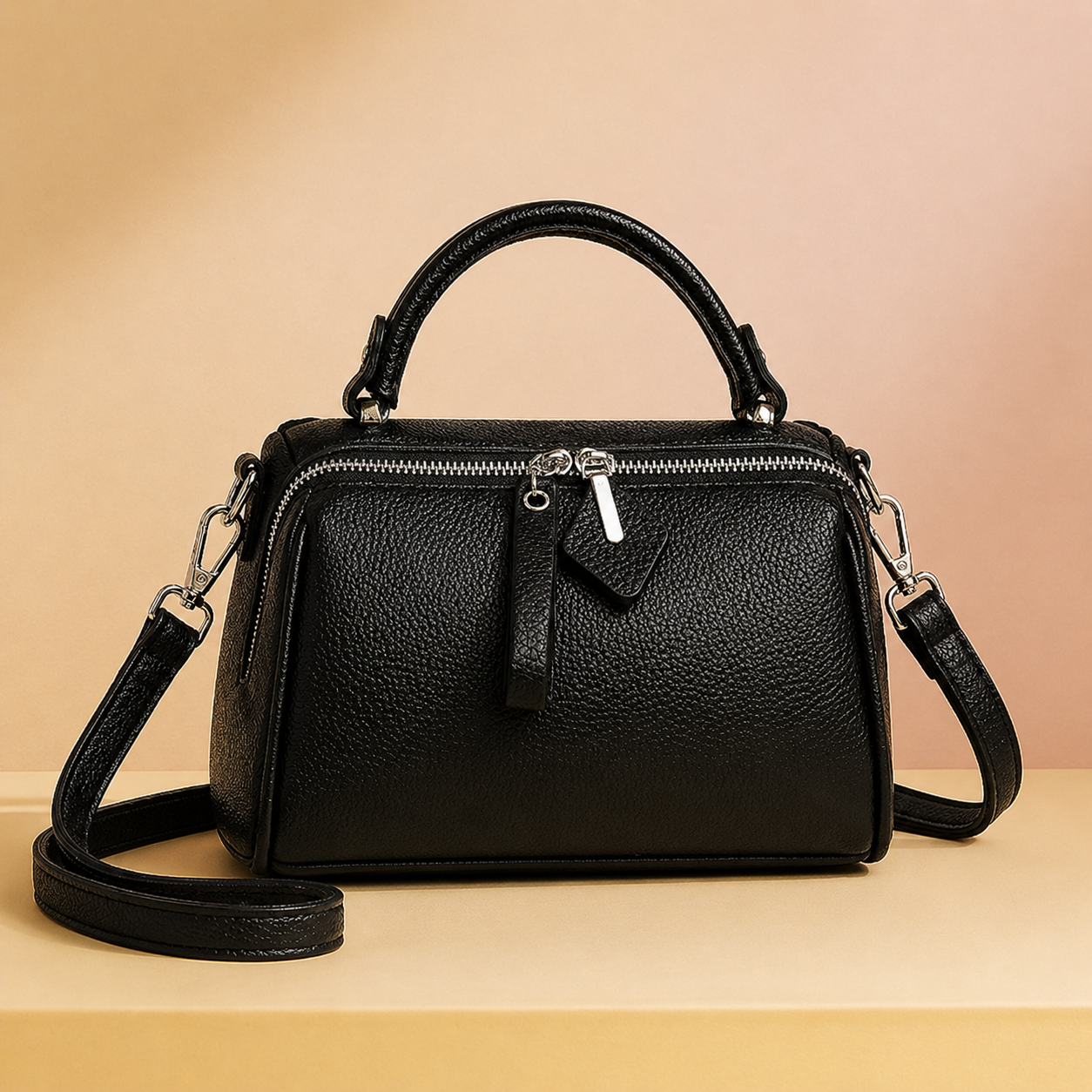Elegantblackleatherhandbagonpedestal.png