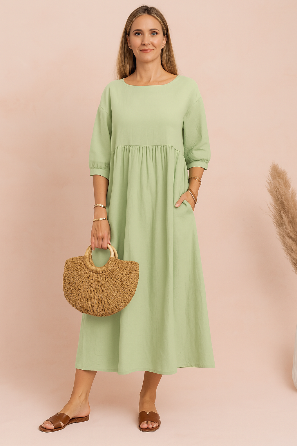 midi dress featuring three-quarter puff sleeves, a high gathered waistline, and a relaxed A-line silhouette