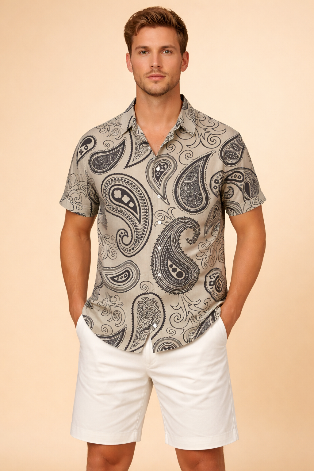 Short-sleeve collared button-up shirt featuring an all-over bold abstract animal-inspired pattern with layered geometric and organic motifs, finished with a front button closure and a clean, structured silhouette.
