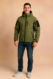Army green tactical softshell jacket with black chest pockets, multiple zippered sleeves, and hood, styled with slim-fit black pants and boots.