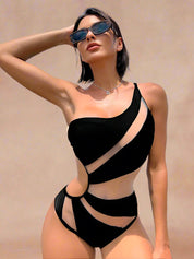 Asymmetrical one-shoulder swimsuit featuring bold geometric cut-outs and a striking trio of color blocks in pastel pink, bubblegum pink, and deep fuchsia. The design includes high-cut legs and a figure-contouring fit, combining sleek paneling and modern negative space.