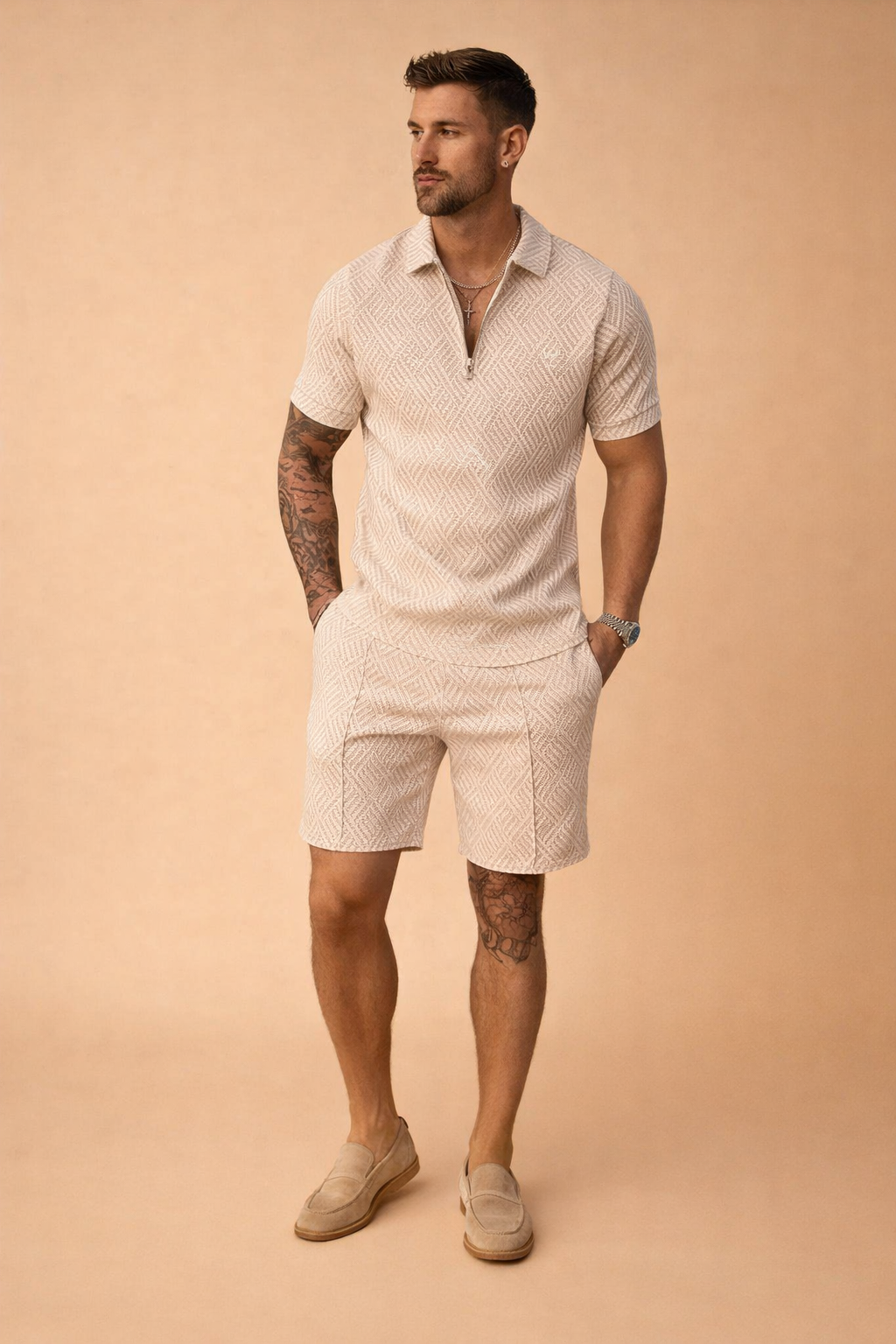 Beige two-piece men’s summer set featuring a short-sleeve zip-neck polo shirt and matching tailored shorts with an all-over geometric woven pattern in soft sand and cream tones