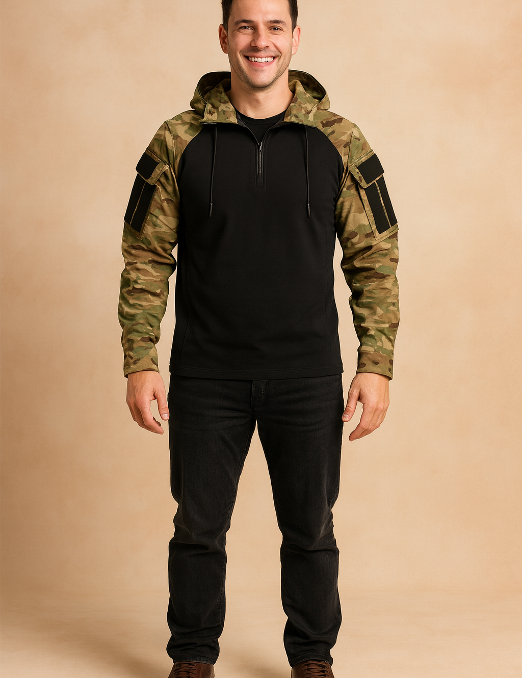 Tactical pullover hoodie with camouflage sleeves and hood, black torso, half-zip closure, and sleeve patch panels, styled in a rugged casual fit.
