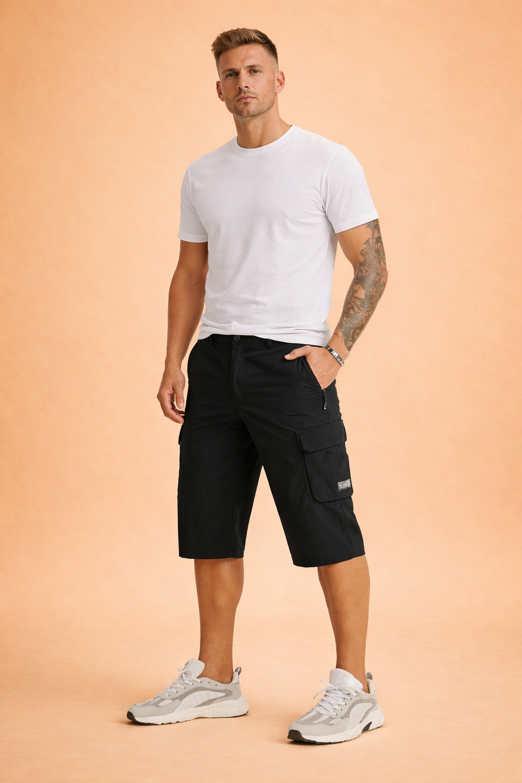 Black utility cargo shorts in smooth matte woven fabric with structured knee-length cut, reinforced seams, zippered side pocket, flap cargo pocket with stitched label, and clean solid color finish, paired with a plain olive-green short-sleeve T-shirt in soft cotton jersey with a minimal, unprinted surface and classic crew neckline, styled with neutral athletic sneakers.