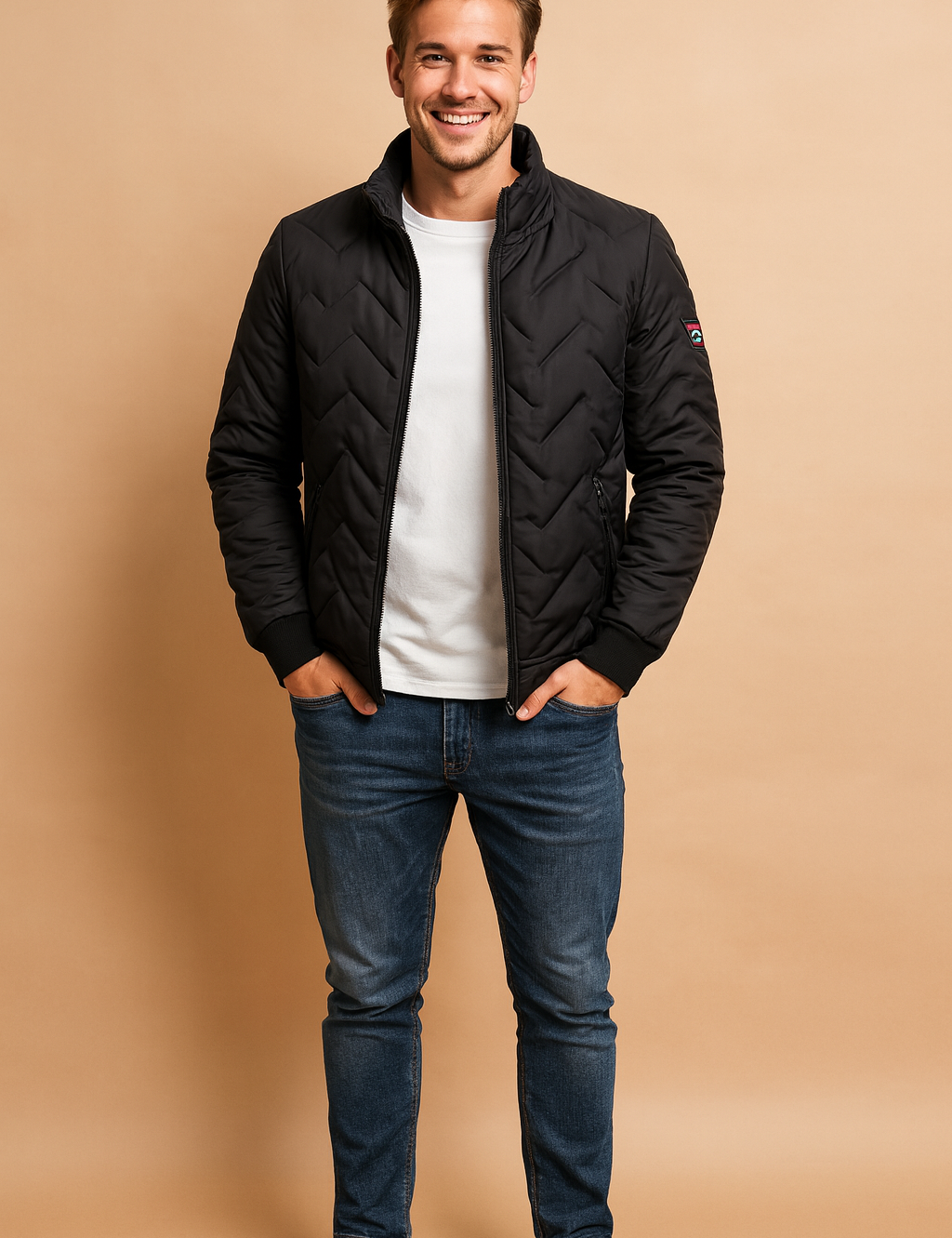 Black chevron quilted jacket with zip closure, side zip pockets, and sleeve patch detail styled for a modern casual look.
