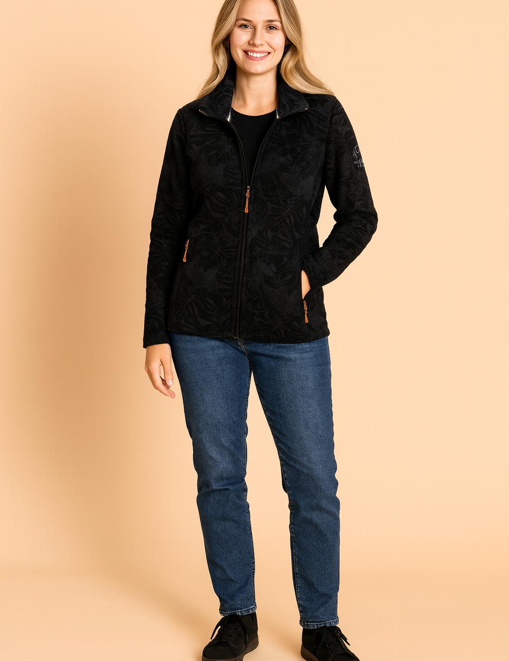 Black fleece jacket with embossed leaf pattern, full zip closure, and side zip pockets.