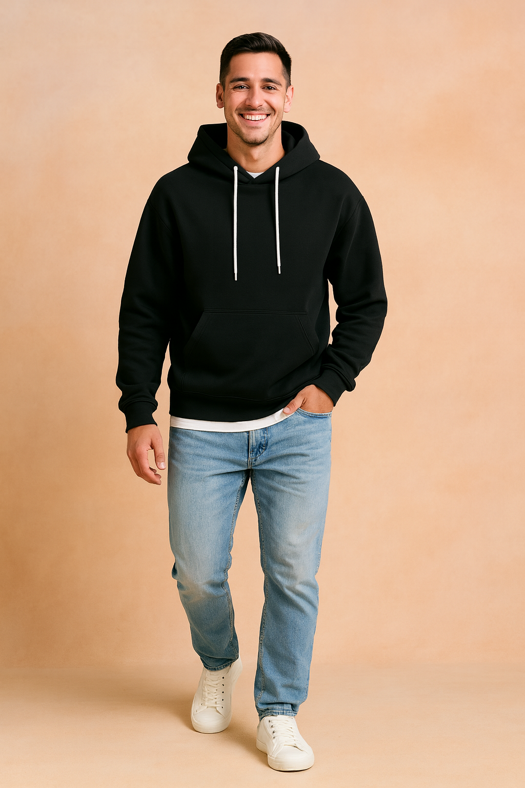 Black hoodie with white drawstrings, paired with light blue jeans and white sneakers, styled in a casual modern fit.