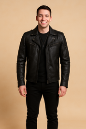 Black leather biker jacket with matte finish, zipper pockets, and shoulder details, styled with black jeans and shoes.