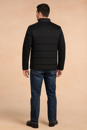 Black padded men's jacket with textured shoulder panel and horizontal quilted stitching, shown from the back.