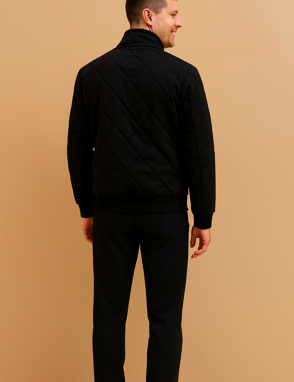 Black quilted men’s jacket with diamond-stitched pattern, ribbed cuffs and hem, and a sleek modern cut designed for casual and semi-formal wear.