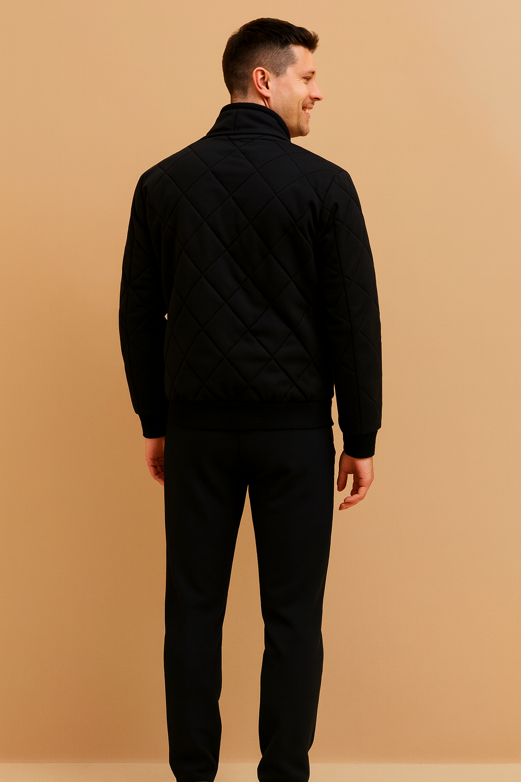 Black quilted men’s jacket with diamond-stitched pattern, ribbed cuffs and hem, and a sleek modern cut designed for casual and semi-formal wear.