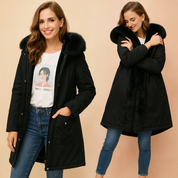 Black parka jacket with faux fur hood and inner lining, front button closure, large pockets, styled with graphic T-shirt, slim-fit denim jeans, and casual