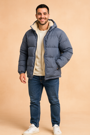 Men’s winter puffer jacket in blue with cream fleece lining, full zip closure, elastic cuffs, and side pockets, designed for warmth and comfort.