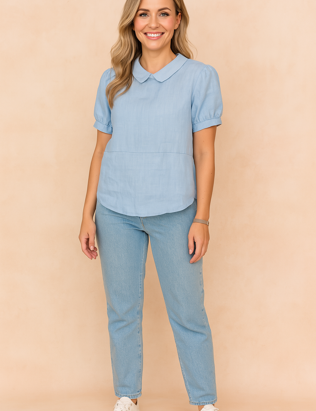 Powder blue linen blouse with Peter Pan collar and short puff sleeves, styled with light-wash jeans and white sneakers.