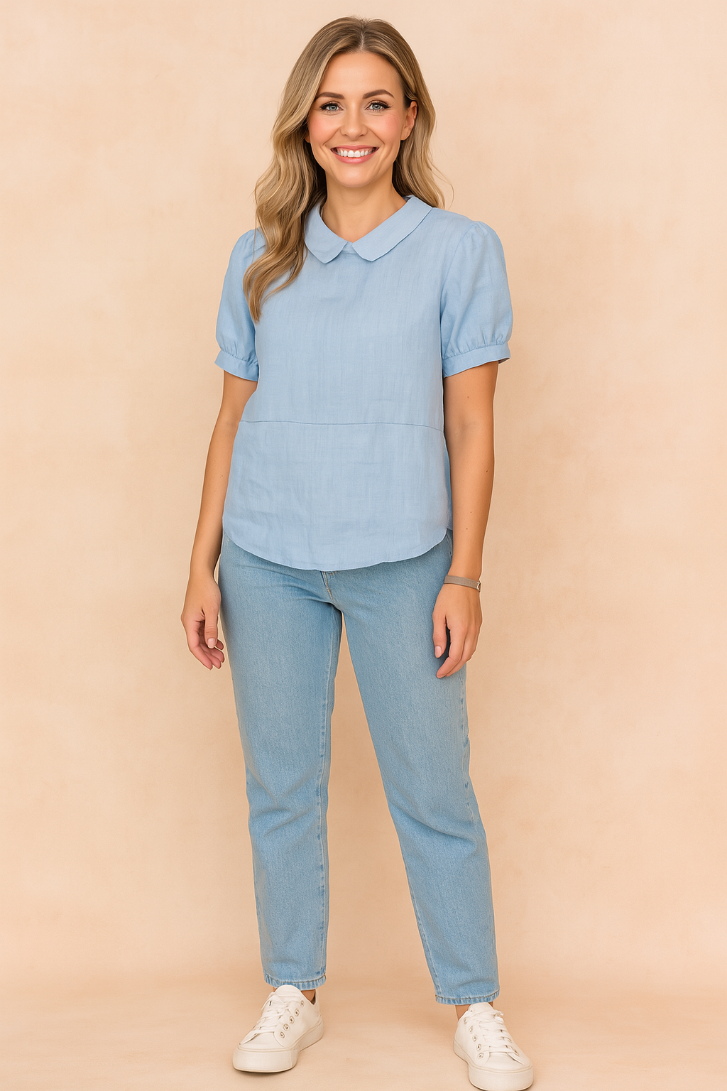 Powder blue linen blouse with Peter Pan collar and short puff sleeves, styled with light-wash jeans and white sneakers.