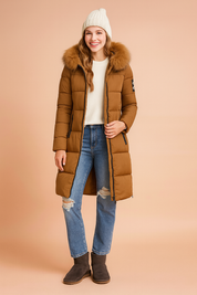 Brown winter parka with fur-trimmed hood, front zipper, and side zip details, styled with black pants and lace-up boots.