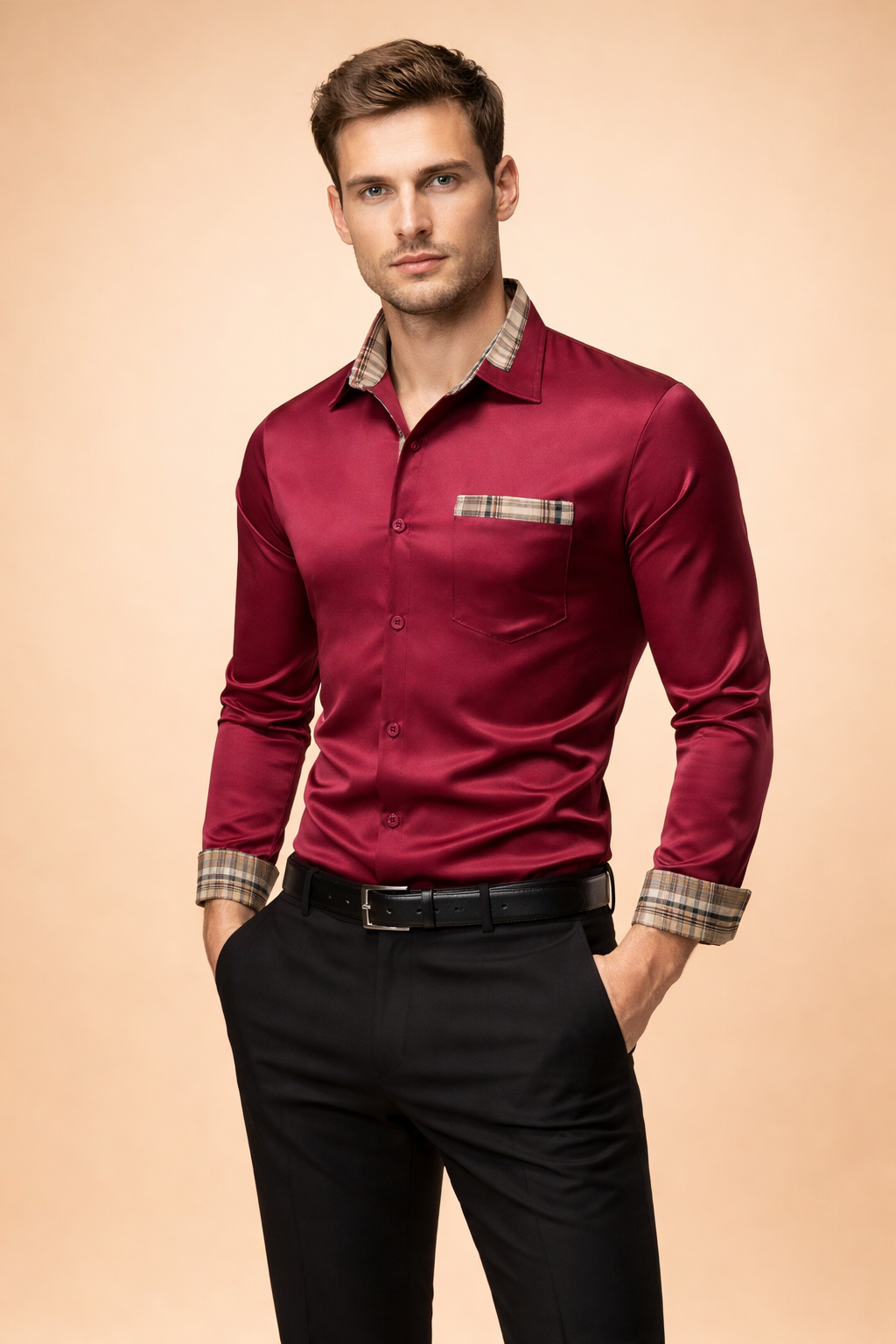 Burgundy satin long-sleeve button-up shirt with contrast plaid trim on collar and cuffs, chest pocket detail, paired with tailored black trousers and belt