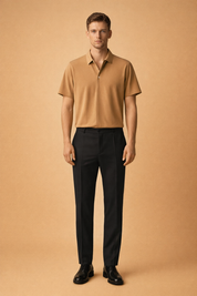 Camel short-sleeve polo shirt with smooth fine-knit texture and clean collar, paired with tailored black slim-fit trousers in a matte woven fabric, styled with classic black leather lace-up dress shoes for a refined modern menswear look.