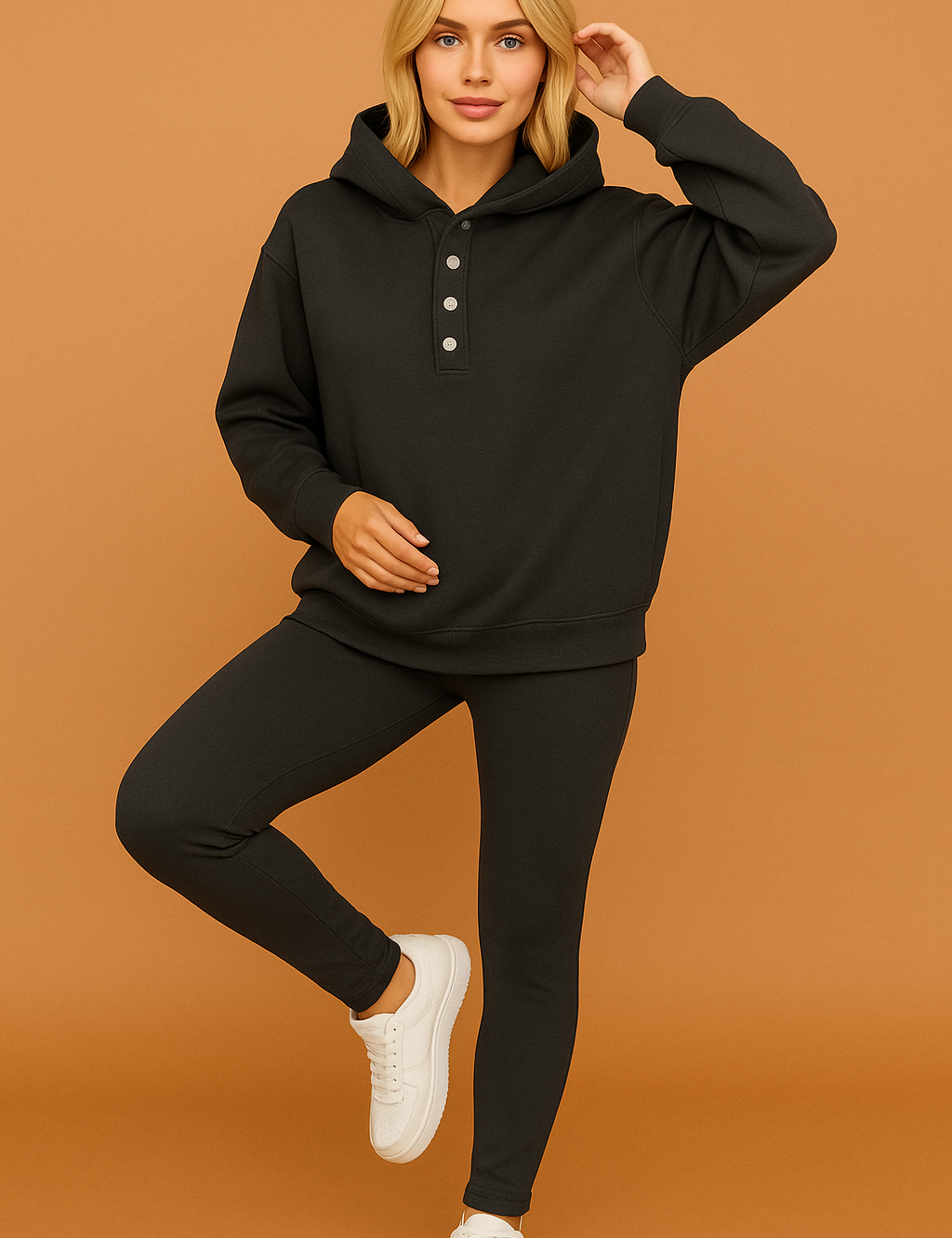 Charcoal gray plain hoodie and leggings loungewear set with silver front buttons, styled with classic white sneakers.