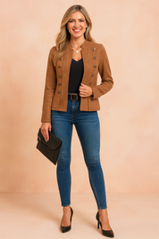 Stylish camel suede military jacket with bronze button accents, paired with a black V-neck top, dark blue slim-fit jeans, and black high heels, accessorized with a black clutch.