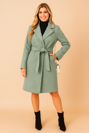 Elegant light blue trench coat with a belted waist, tailored lapel collar, and button detailing, offering a chic and modern silhouette.