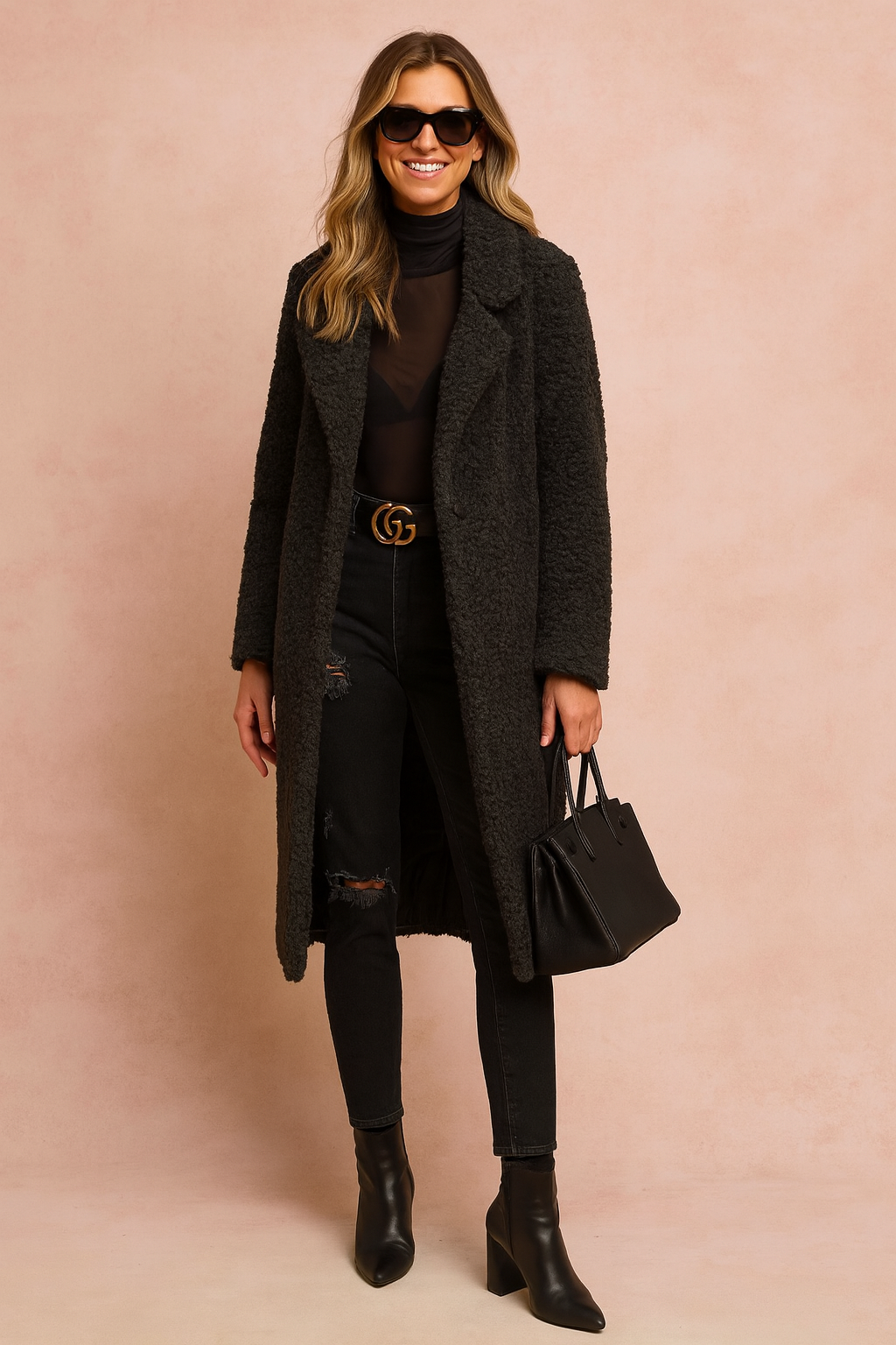  Black textured long coat paired with a sheer black turtleneck, black distressed skinny jeans, black leather ankle boots, and a structured black handbag.