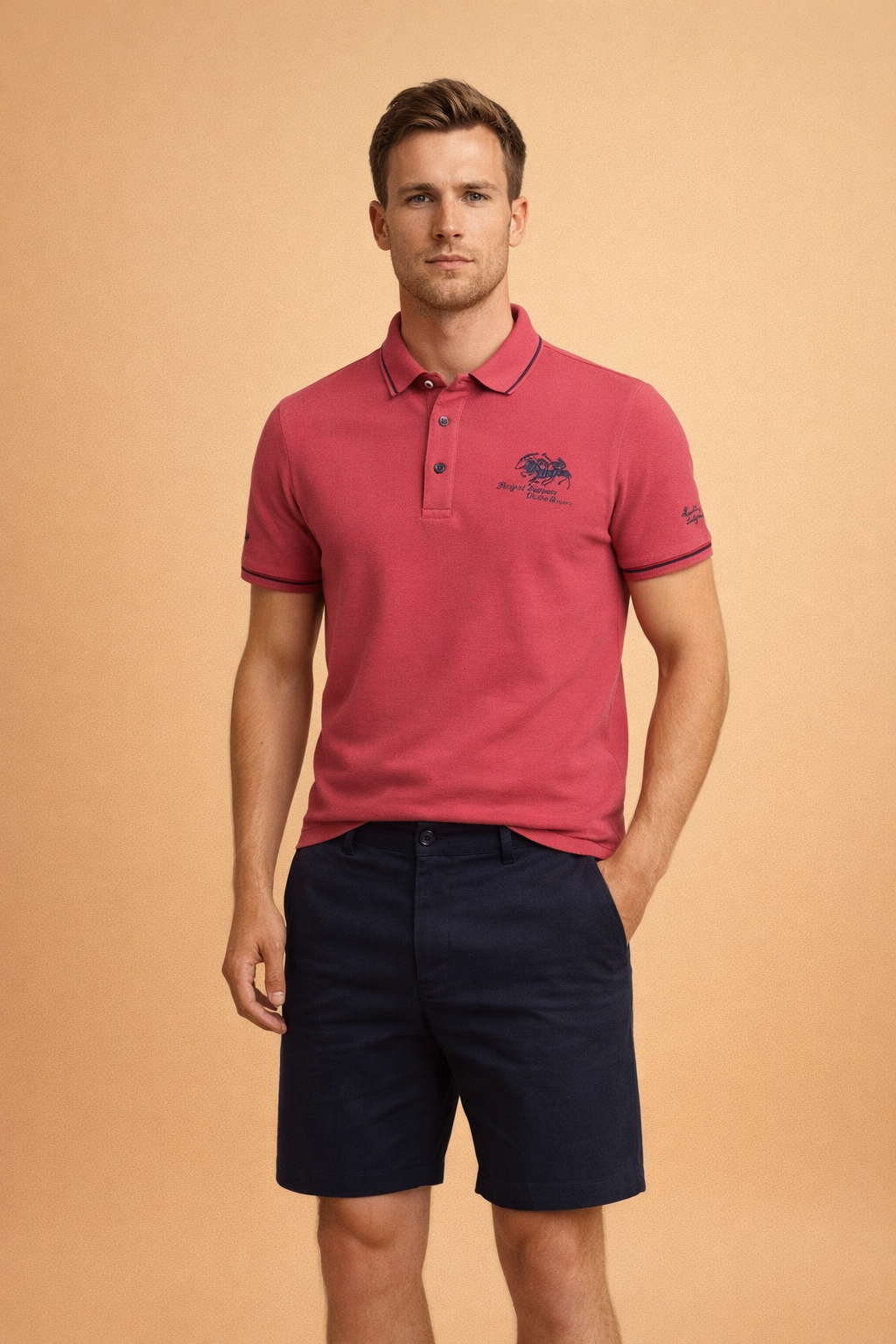 Classic coral red short-sleeve polo shirt with structured collar, three-button placket, embroidered chest crest, smooth knit fabric, and clean tailored finish.