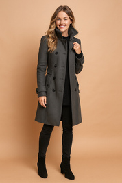 Dark gray tailored trench coat with double-breasted button closure, structured high collar, front flap pockets, and belted cuff details.