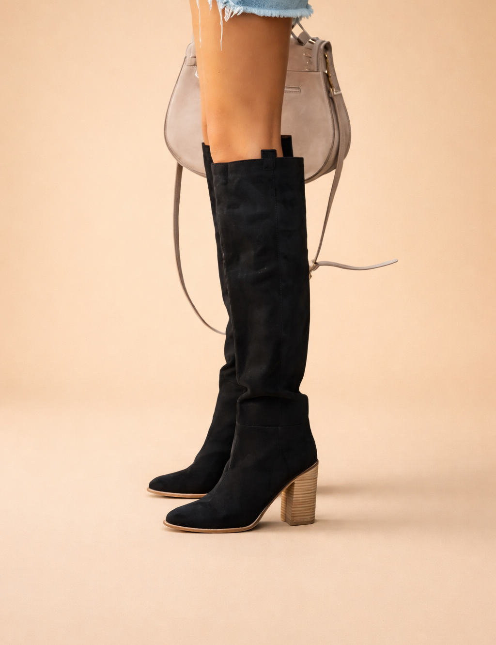 elegant-model-black-knee-high-boots-studio-pose-luxury-editorial.png