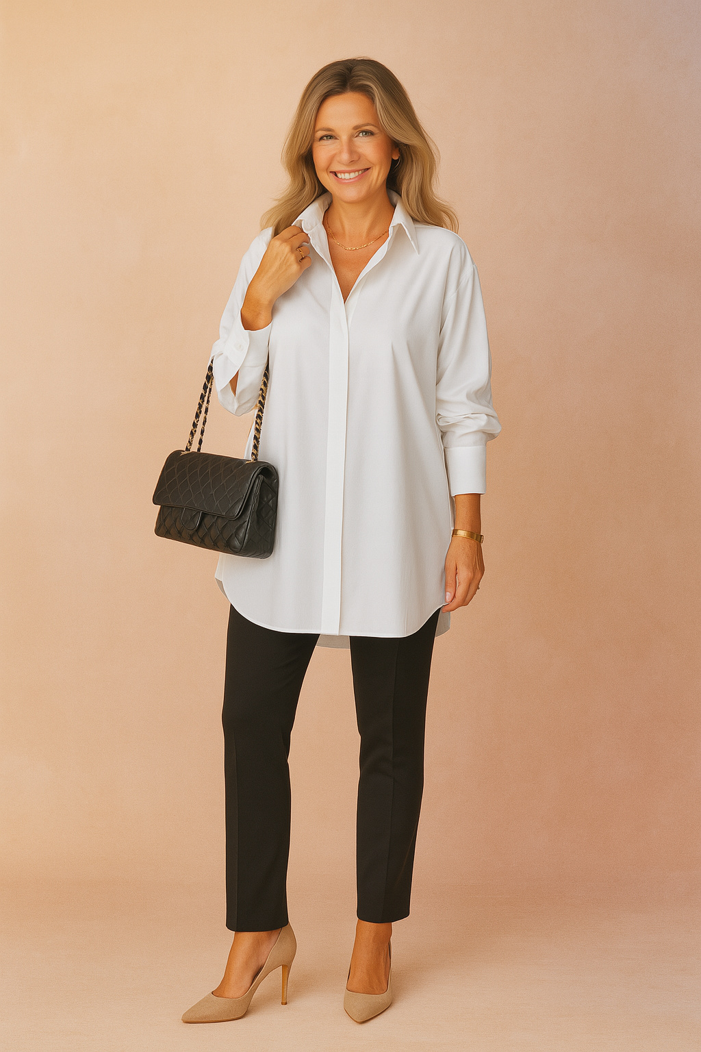 Oversized white button-up shirt with a crisp collar and long sleeves, paired with fitted black pants and a classic quilted black handbag featuring chain straps.