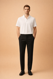 White short-sleeve polo shirt with clean collar and smooth structured fabric, paired with tailored black straight-leg trousers featuring a flat front, sharp crease lines, and a refined minimalist finish, styled with classic black leather lace-up dress shoes for a modern elegant menswear look