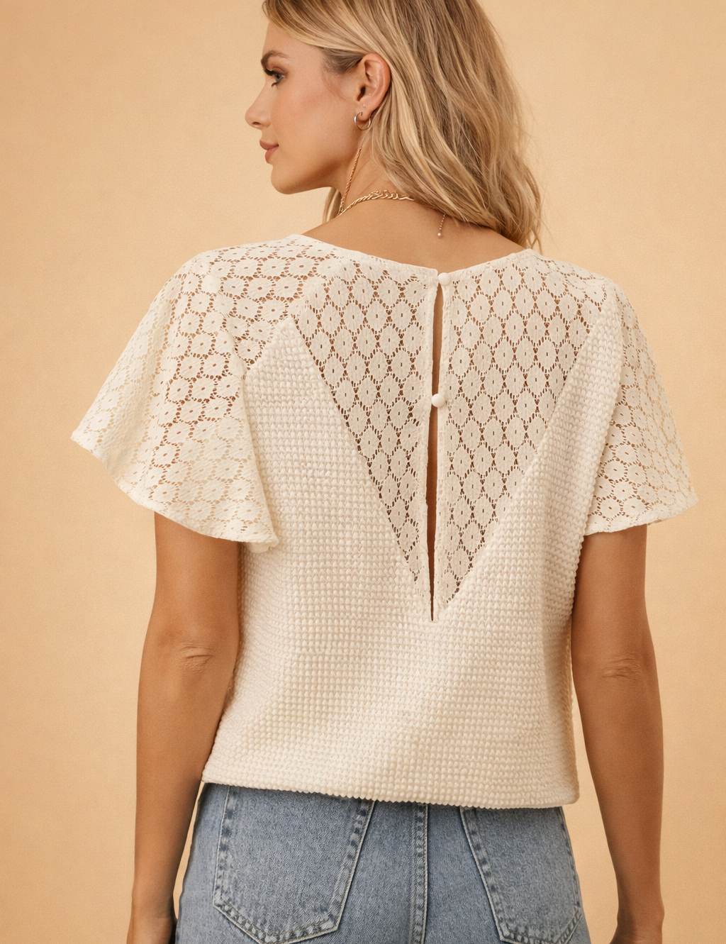 european-model-back-view-textured-lace-panel-blouse-flutter-sleeve-posed-studio-shot.png