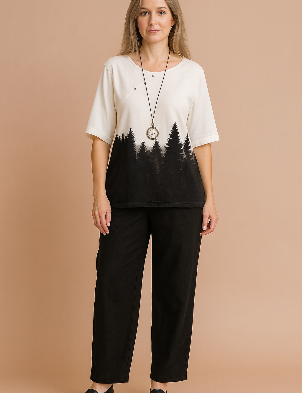  Two-piece forest-print casual outfit featuring a white half-sleeve top with black pine tree silhouette design and relaxed black ankle-length pants, styled with a vintage pendant necklace.
