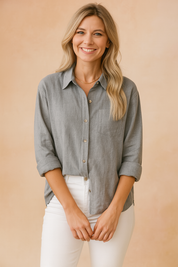 Light gray textured button-up blouse with a chest pocket and rolled sleeves, paired with white jeans in a relaxed, semi-tucked style.