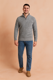 Gray quarter-zip knit sweater for men with ribbed cuffs and hem, featuring a textured fabric pattern, styled with classic casual jeans for a modern and versatile look.