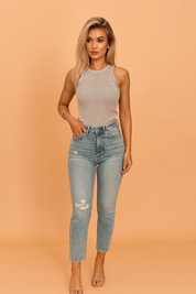Women's sleeveless fitted gray ribbed tank top styled with distressed high-rise light wash jeans, perfect for casual wear. The top features a subtle washed texture with a seamless neckline, ideal for summer or layered outfits.