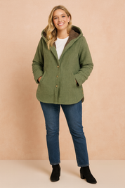 Green houndstooth hooded jacket with brown sherpa lining, button-front closure, two side pockets, and rolled sleeves, styled in a casual fit for autumn and winter wear.