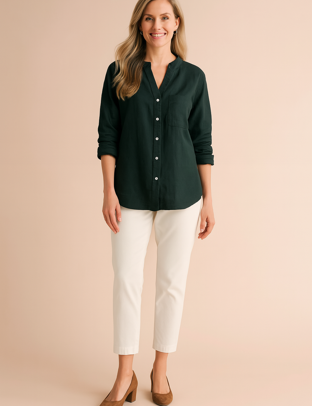 Long-sleeve forest green button-down blouse with a single chest pocket and cuffed sleeves, styled with white cropped pants and tan suede heels.