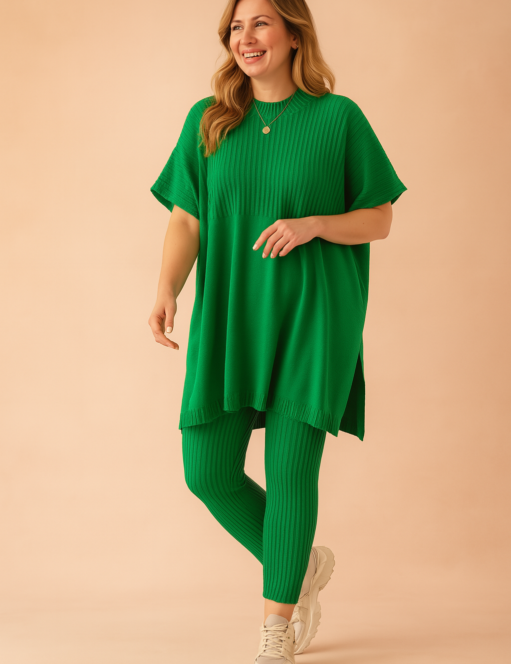Two-piece green ribbed knit loungewear set featuring a loose-fit short-sleeve tunic top with side slits and matching high-waisted ankle-length leggings.
