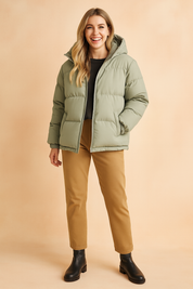 Green hooded puffer jacket with quilted padding, front zipper closure, elastic cuffs, and two side pockets, designed for casual winter wear