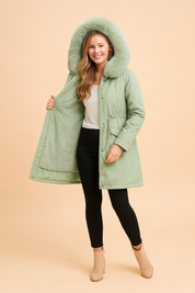 Green winter parka jacket with thick faux fur lining and hood, designed for warmth and comfort with a sleek urban style.