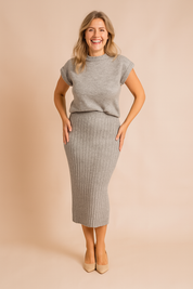 Two-piece heather grey knitted co-ord set featuring a short-sleeve sweater top with rolled cuffs and a high-waisted ribbed midi pencil skirt in a soft, textured knit fabric.