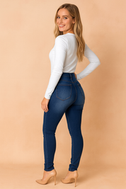High-waisted dark blue skinny jeggings for women with back pocket details and seamless stretch fit, designed for a flattering everyday look