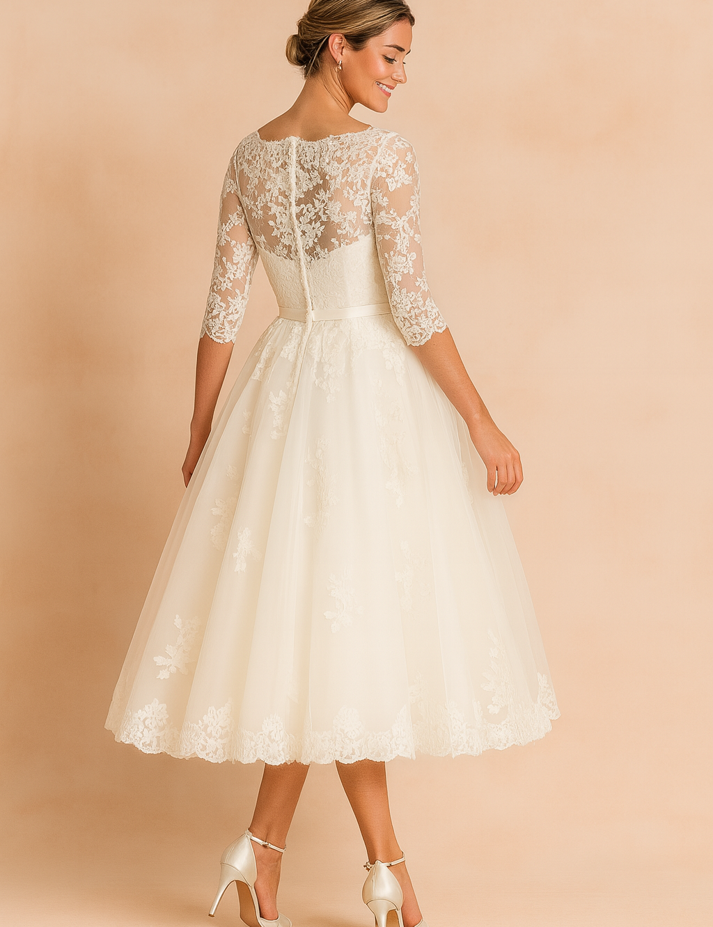 Elegant ivory lace tea-length wedding dress featuring a fitted bodice, sheer three-quarter lace sleeves, a scalloped hemline, and a flared A-line skirt with delicate floral lace detailing.